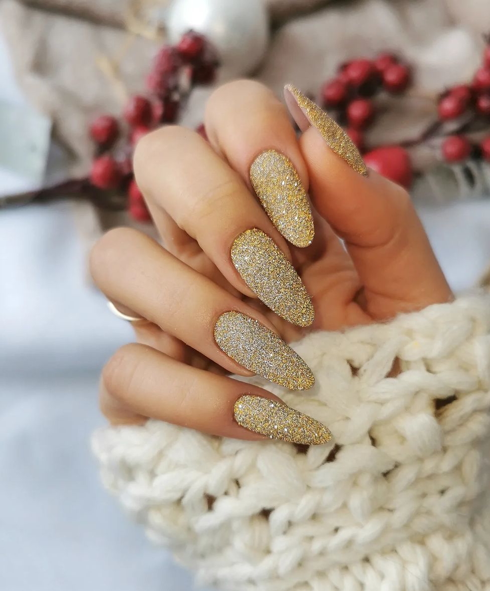 Gold Glitter: full-coverage gold glitter on medium almond nails