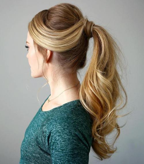 High ponytail with a strand of hair wrapped around its base, retro finish