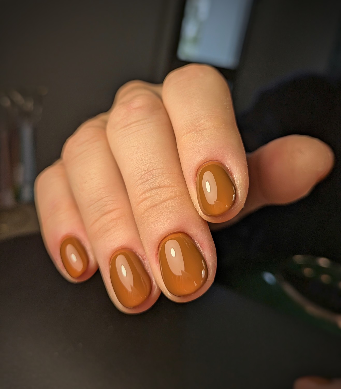 Short oval nails in butterscotch caramel glossy polish