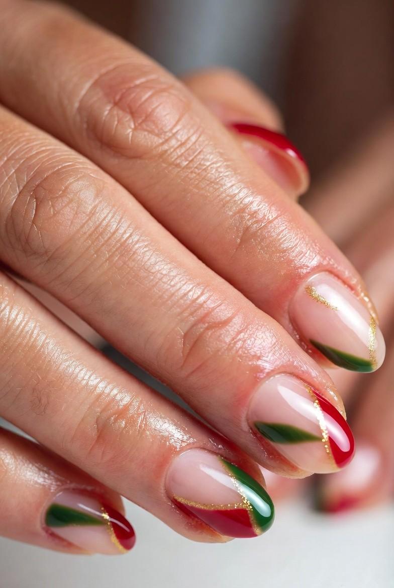 Almond nails with a red-and-green split color block design separated by a thin gold stripe