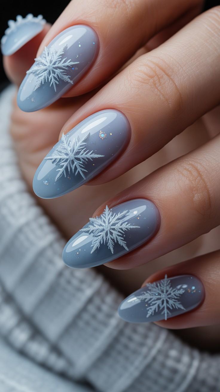 Misty blue-grey nails with white snowflake art