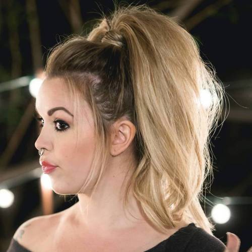 Low sleek ponytail with hair wrapped neatly around the base