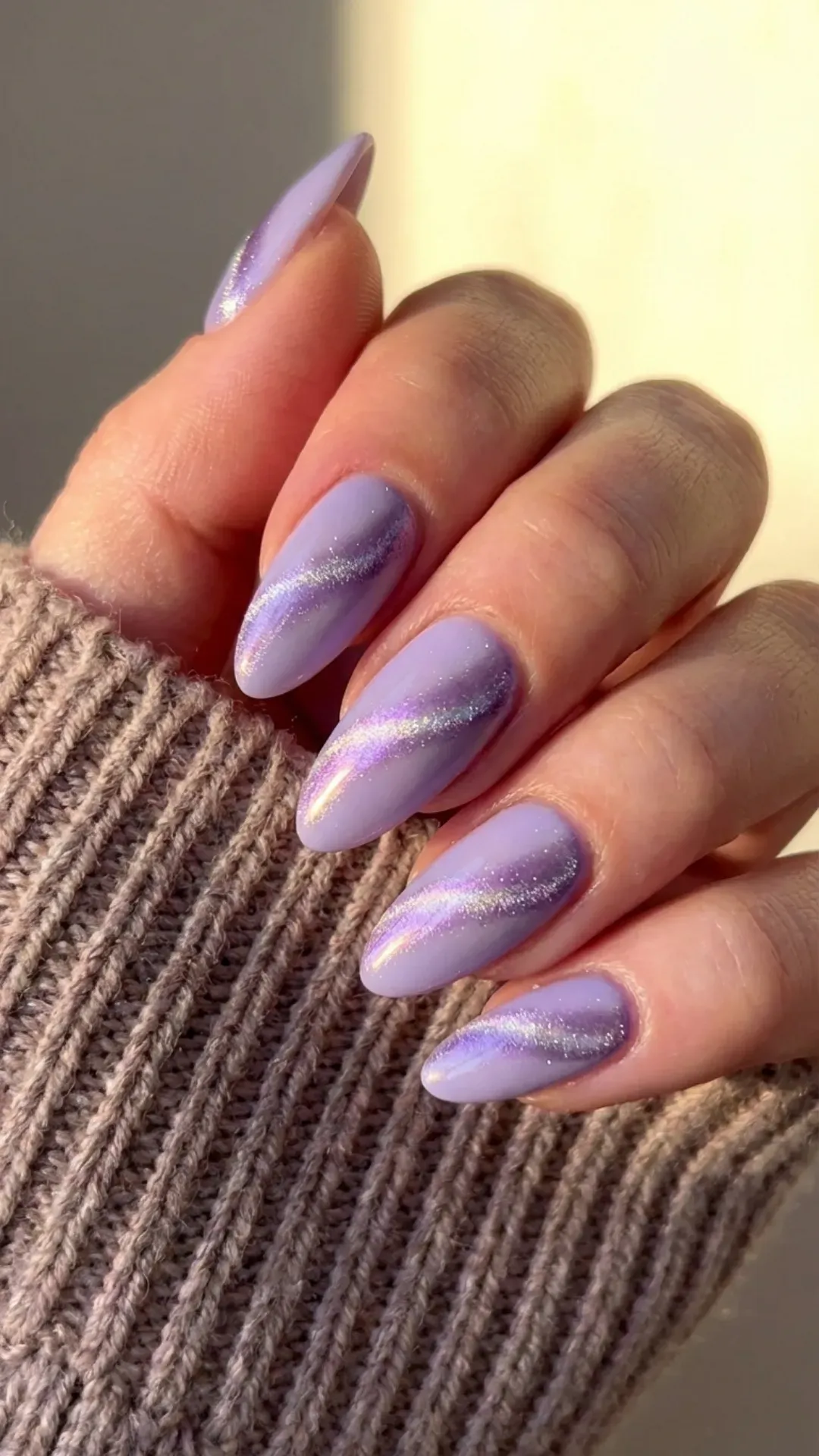 Almond nails with frosted lavender cat-eye shimmer