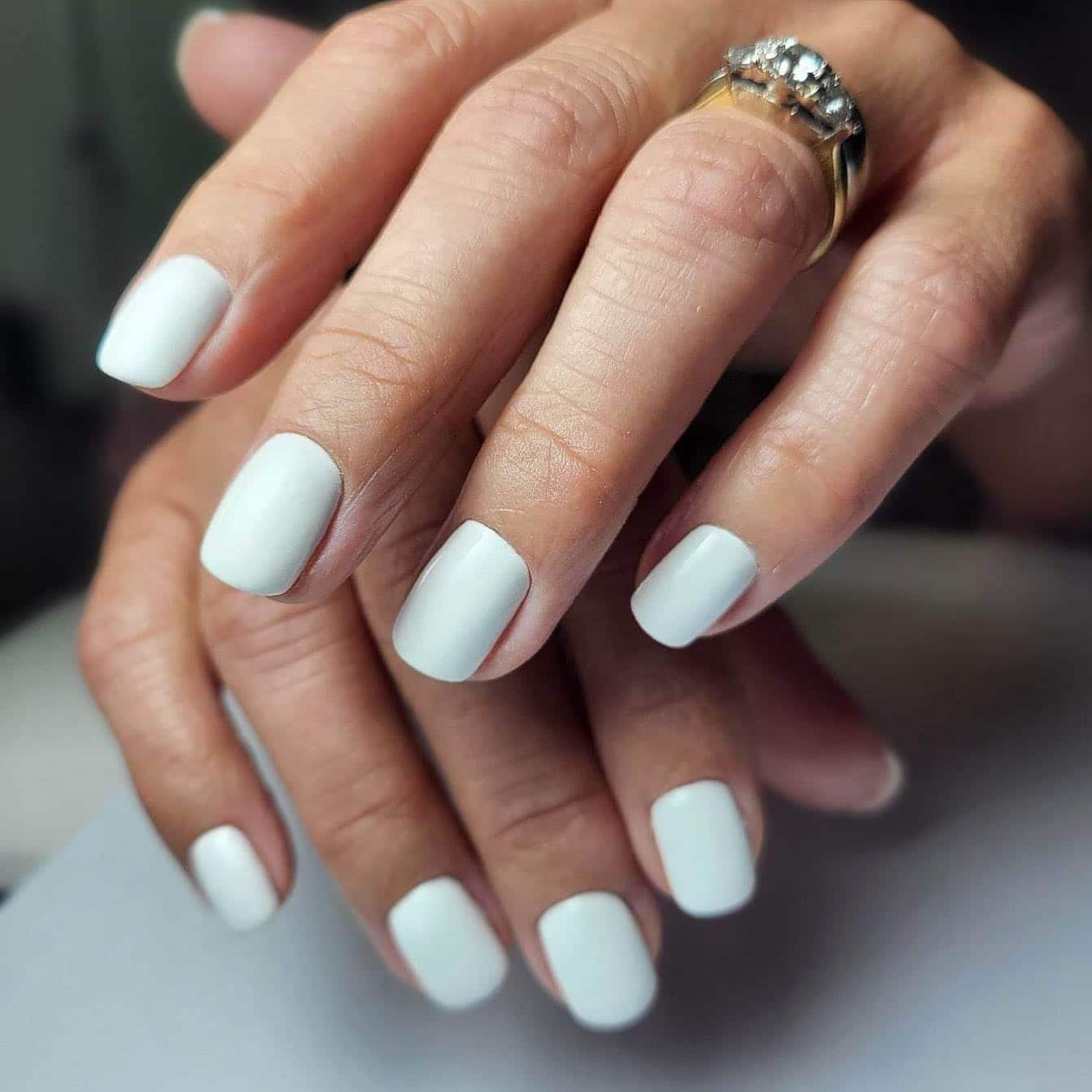 Minimal matte white manicure on short nails