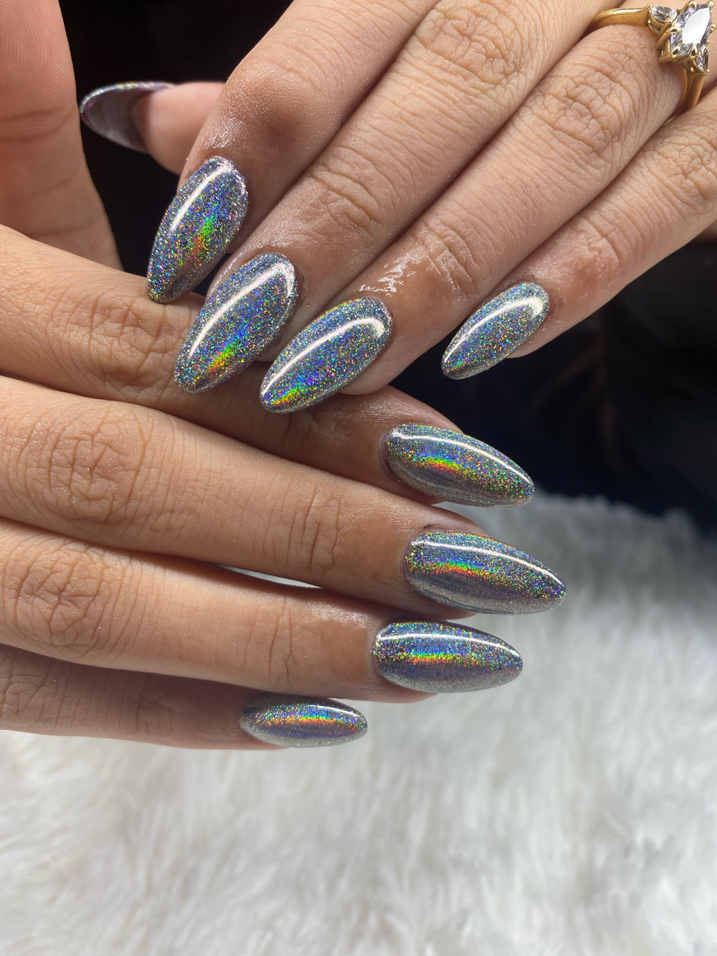 Silver holographic glitter nails on long almond