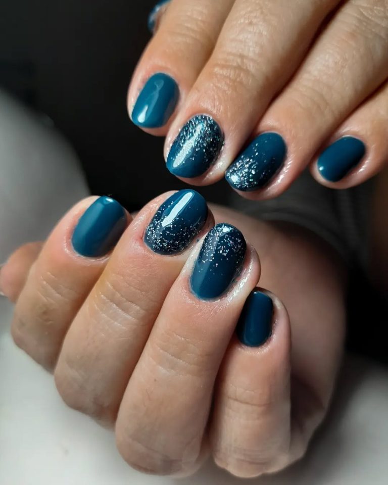 Deep teal nails with silver glitter ombré on accent nails