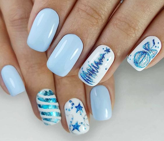 Short icy blue Christmas nails with white glitter Christmas tree and ornament art