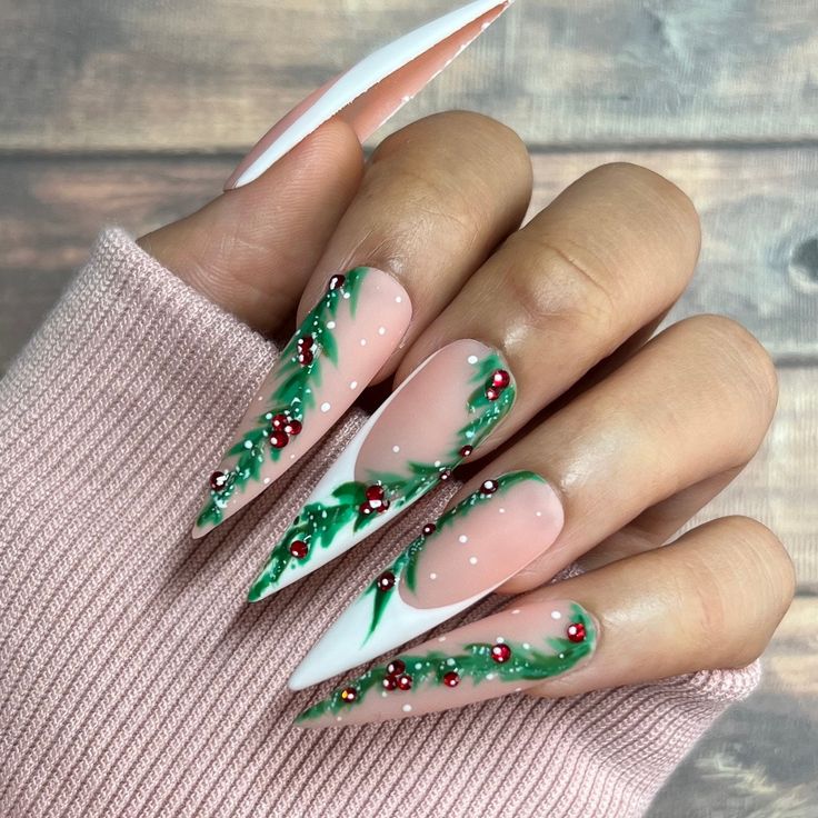 Nude stiletto nails with white french tips and painted holly branch art