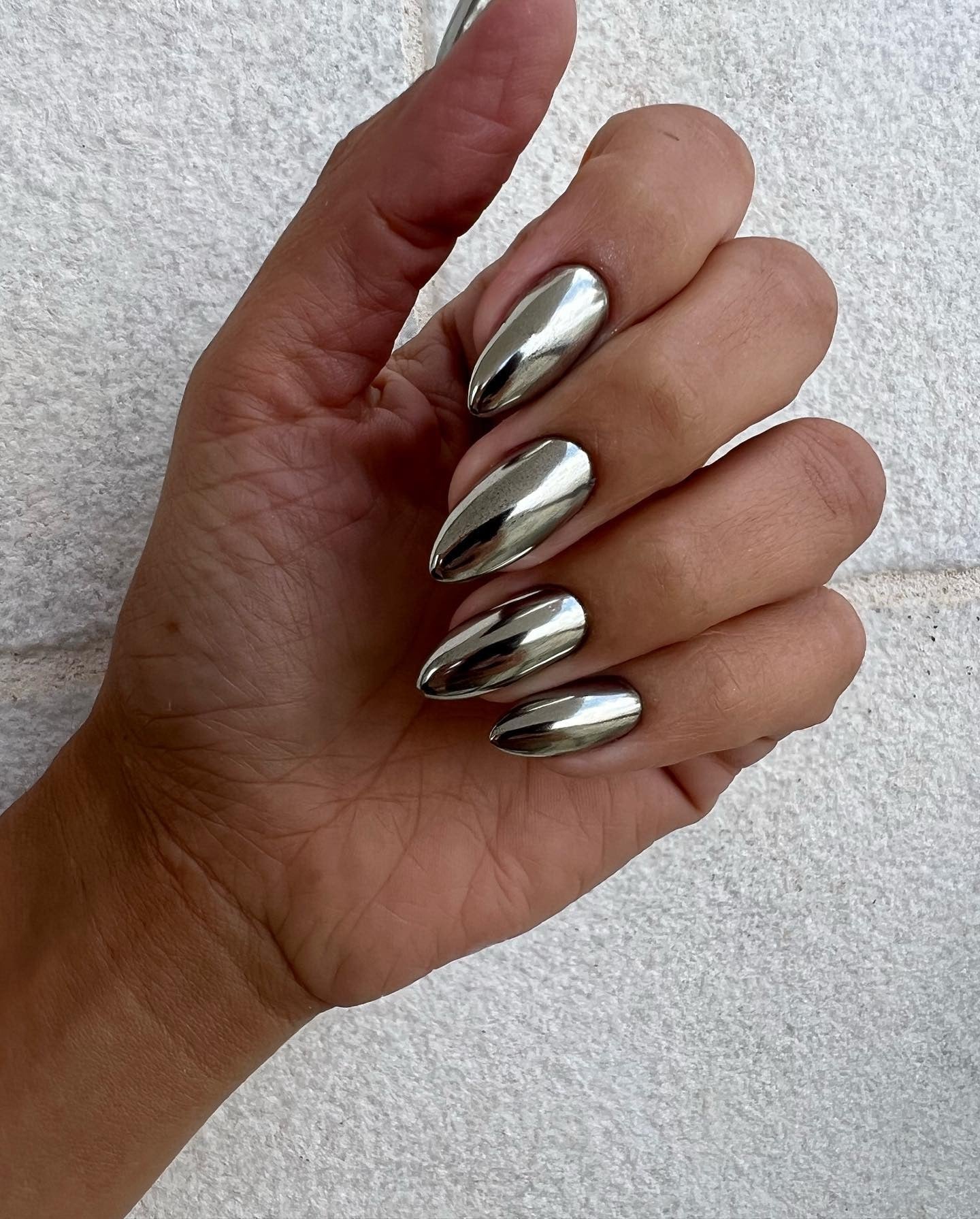 Silver chrome winter nails with liquid shine