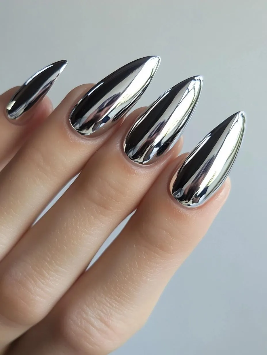 Silver chrome mirror nails on long almonds