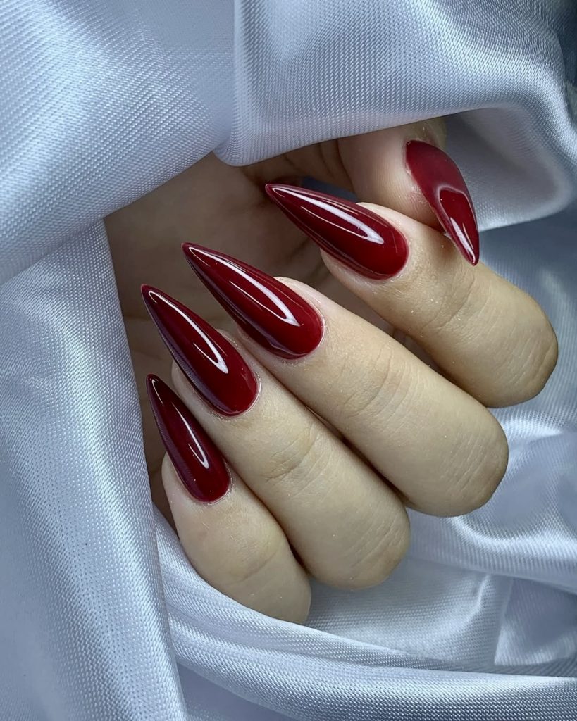 Black Cherry: a near-black cherry gloss on long almond nails