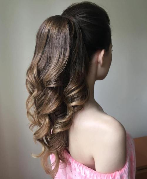 Formal high ponytail with long defined curls and lifted crown