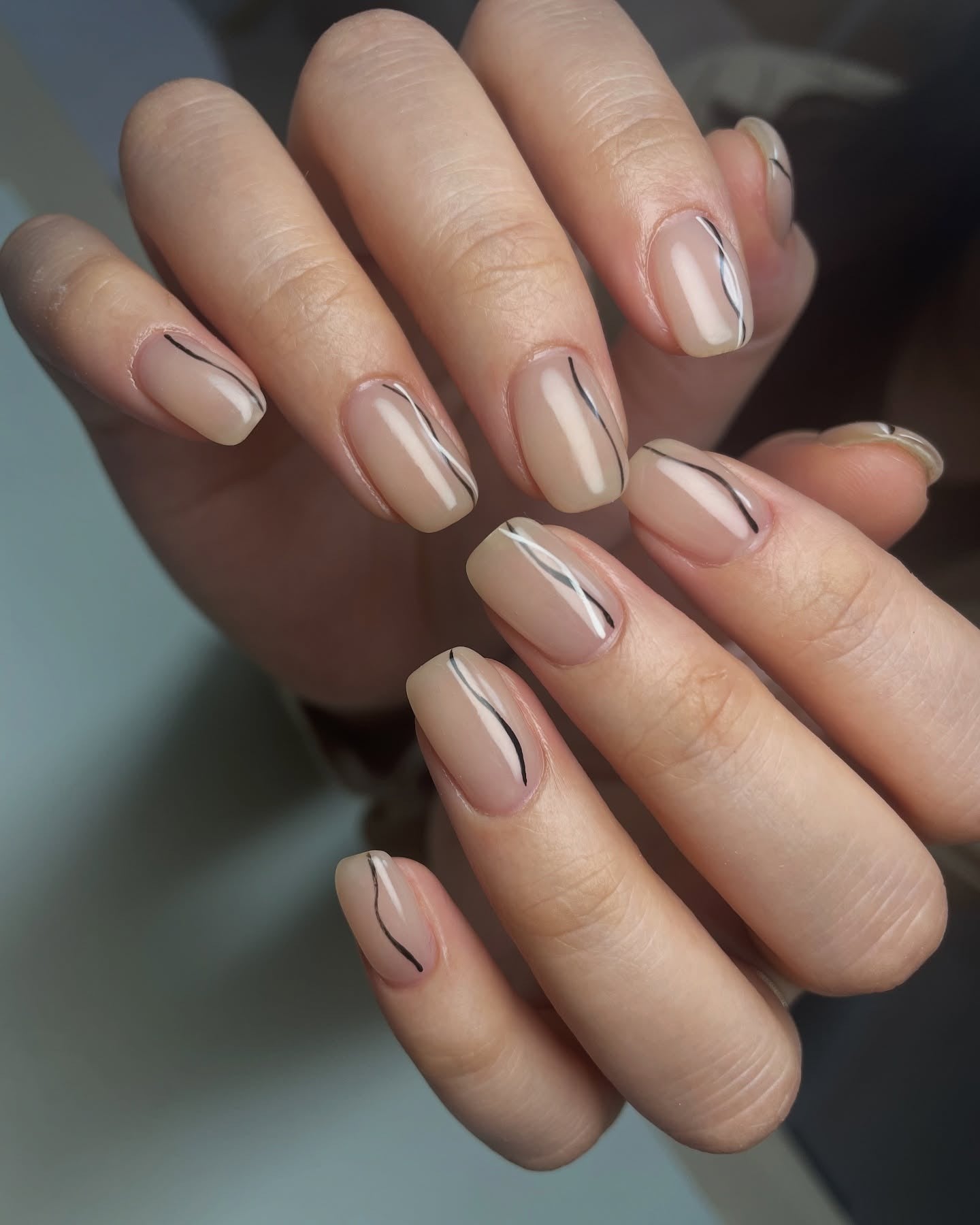 Matte beige nails with minimalist line art