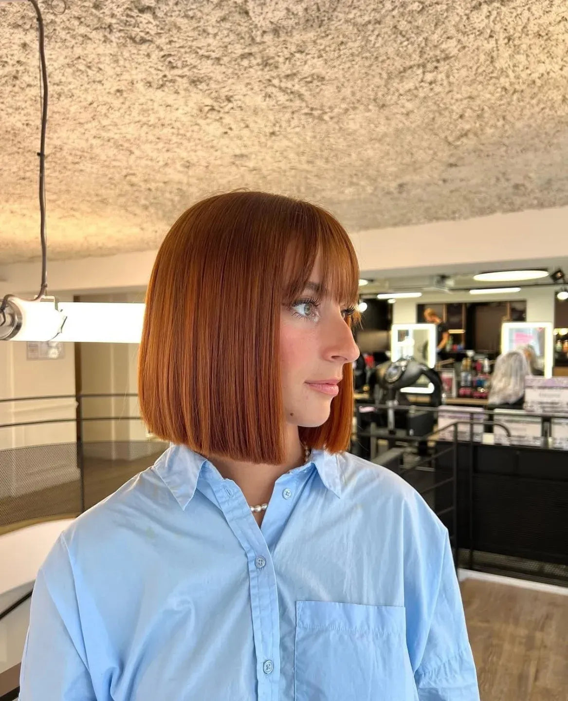 Copper blunt bob with a sleek full fringe
