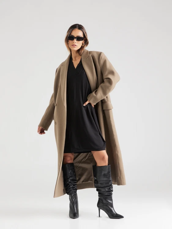 Black slouchy stiletto knee-high boots with a black mini dress and camel coat