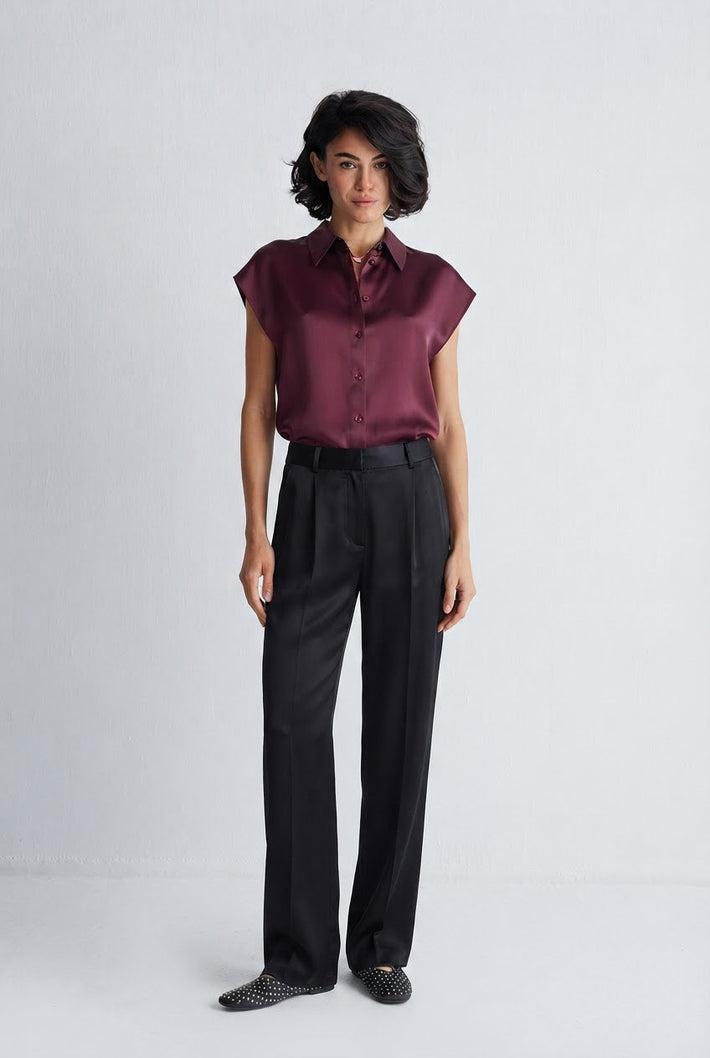 Burgundy silk blouse styled with black trousers