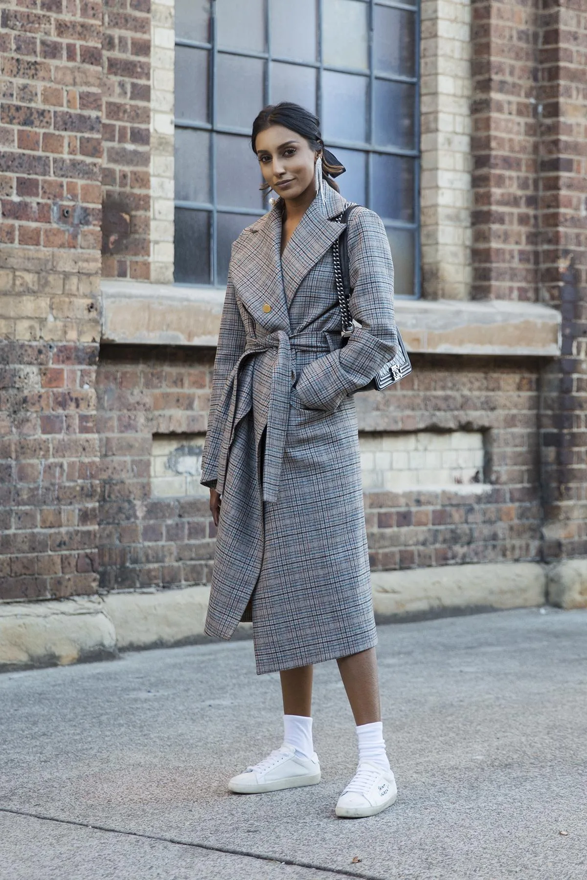 Street style look with a grey plaid coat and white sneakers