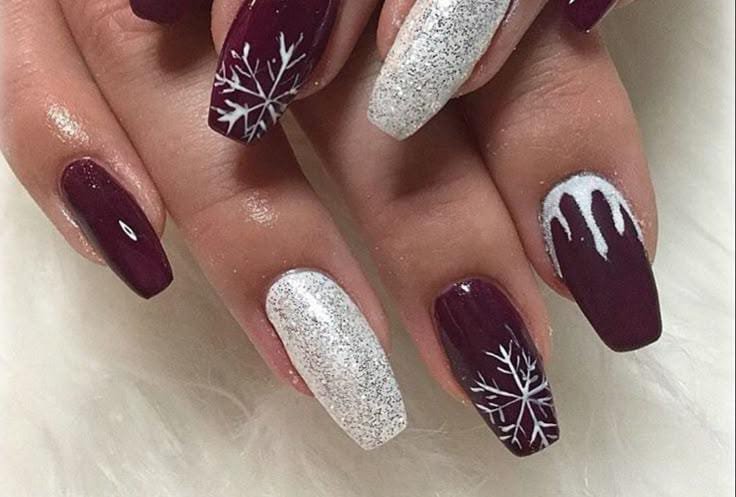 Medium coffin nails in deep plum with silver glitter accent nails and white snowflake art