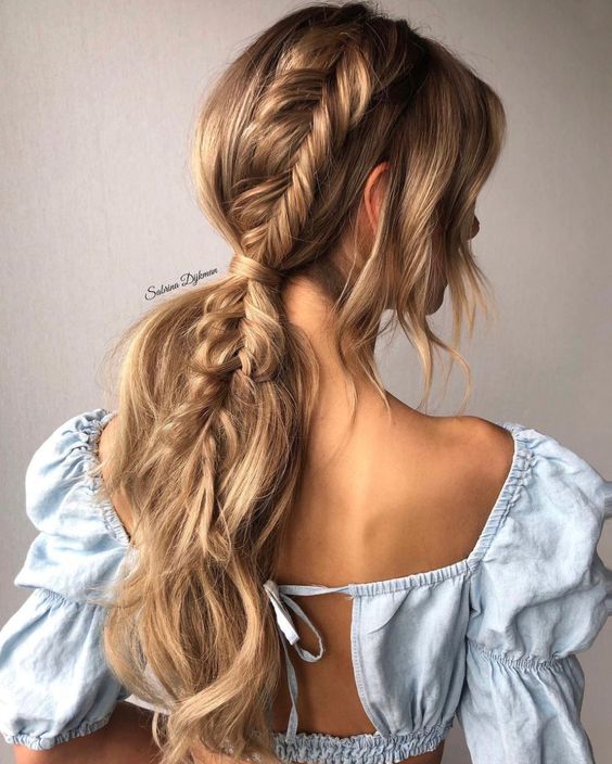 Dutch braid leading into a low ponytail