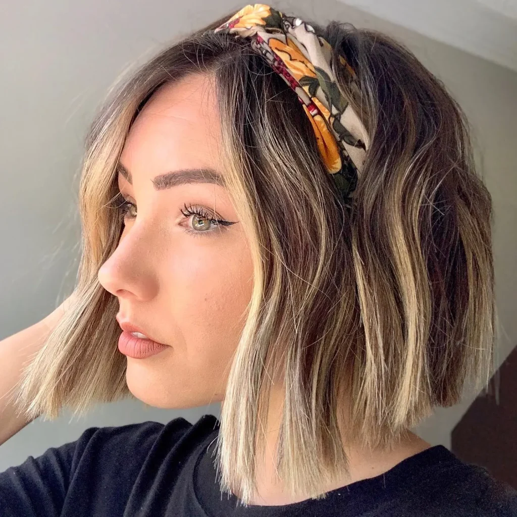 Balayage bob with a patterned fabric headband pushed back