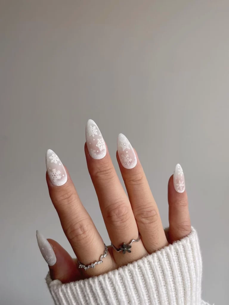 Short milky white almond Christmas nails with white snowflakes