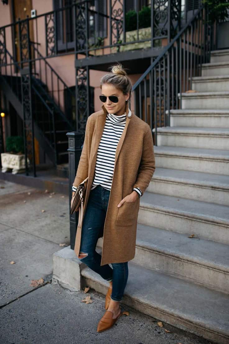A camel coatigan worn with a striped turtleneck, dark skinny jeans and tan mules