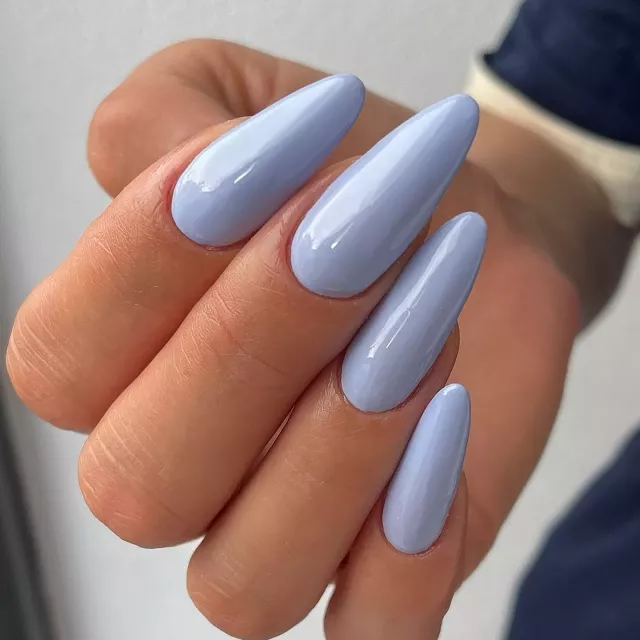 Short stiletto nails in glossy powder blue