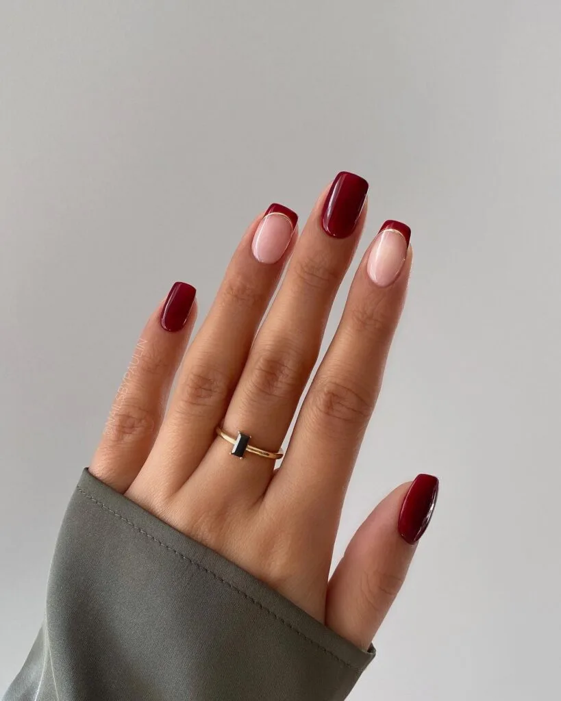 Short oval nails in deep burgundy wine-toned polish
