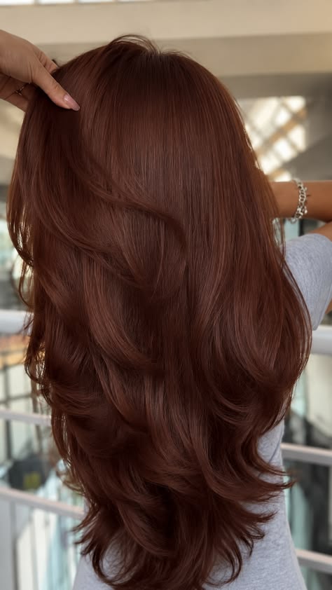 Medium-length layered mahogany brown hair