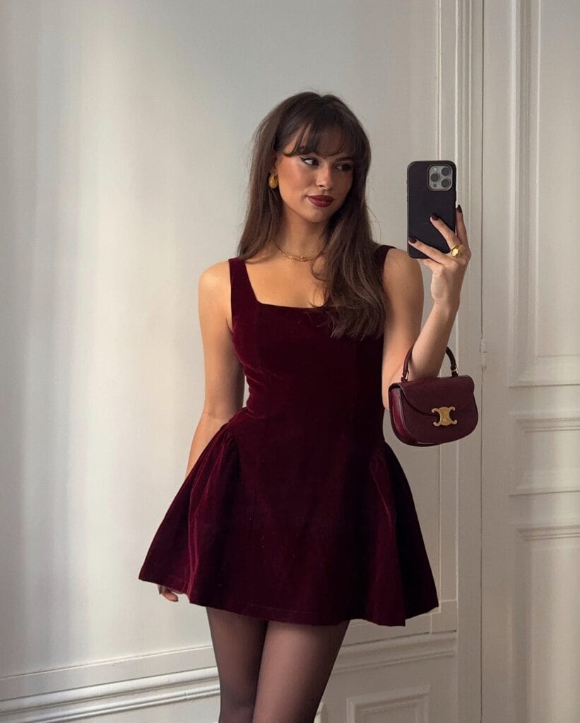 Woman wearing a red satin dress for New Year's Eve