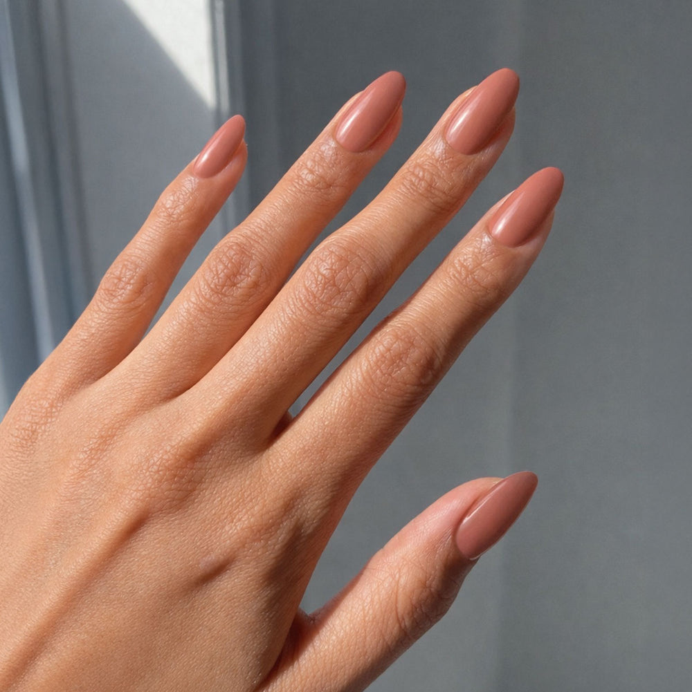 Warm caramel nude glossy hand manicure