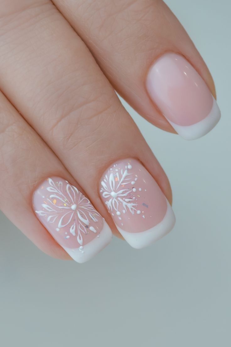 French manicure with snowflake nail art design