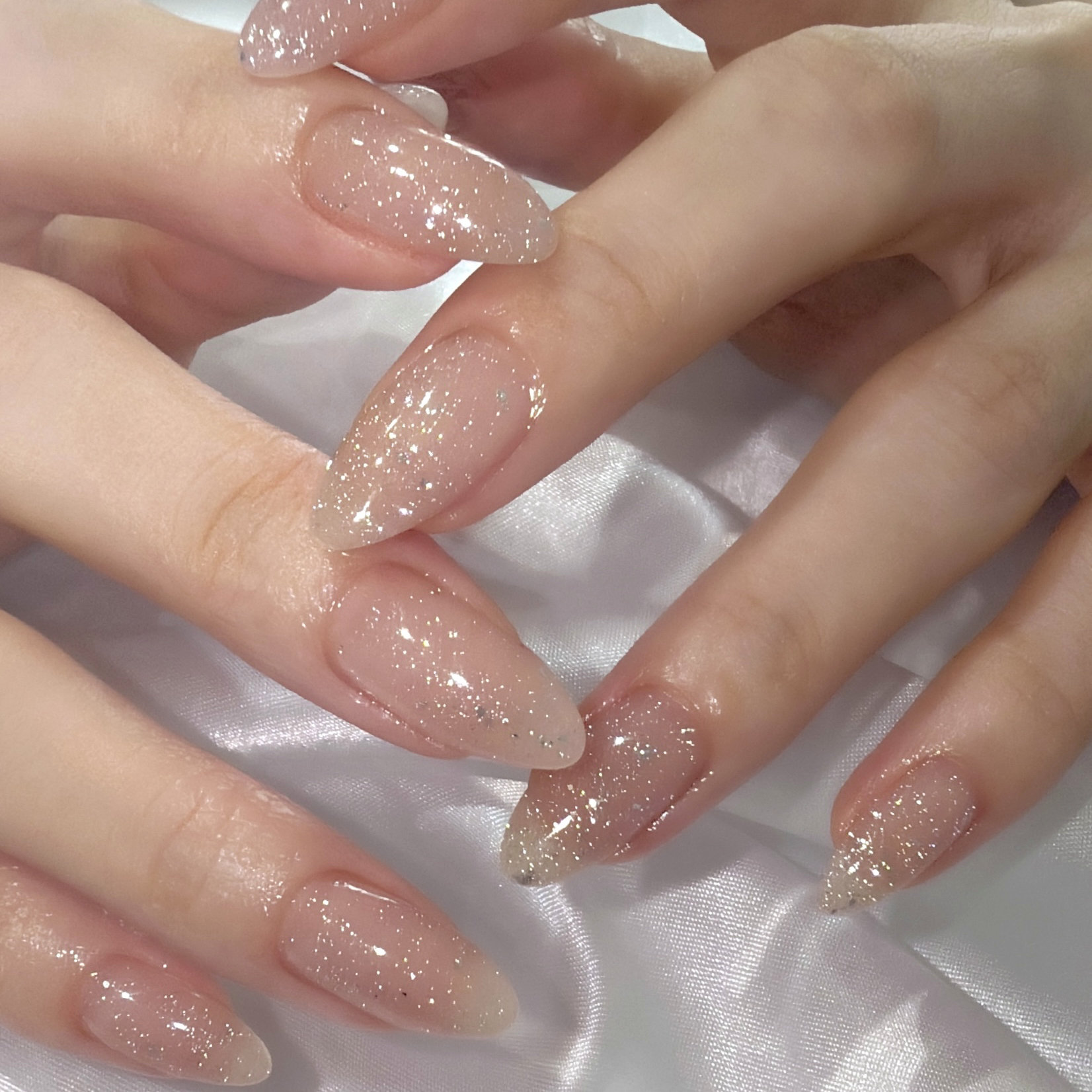 Fine Dust Shimmer: barely-there glitter dust on natural oval nails