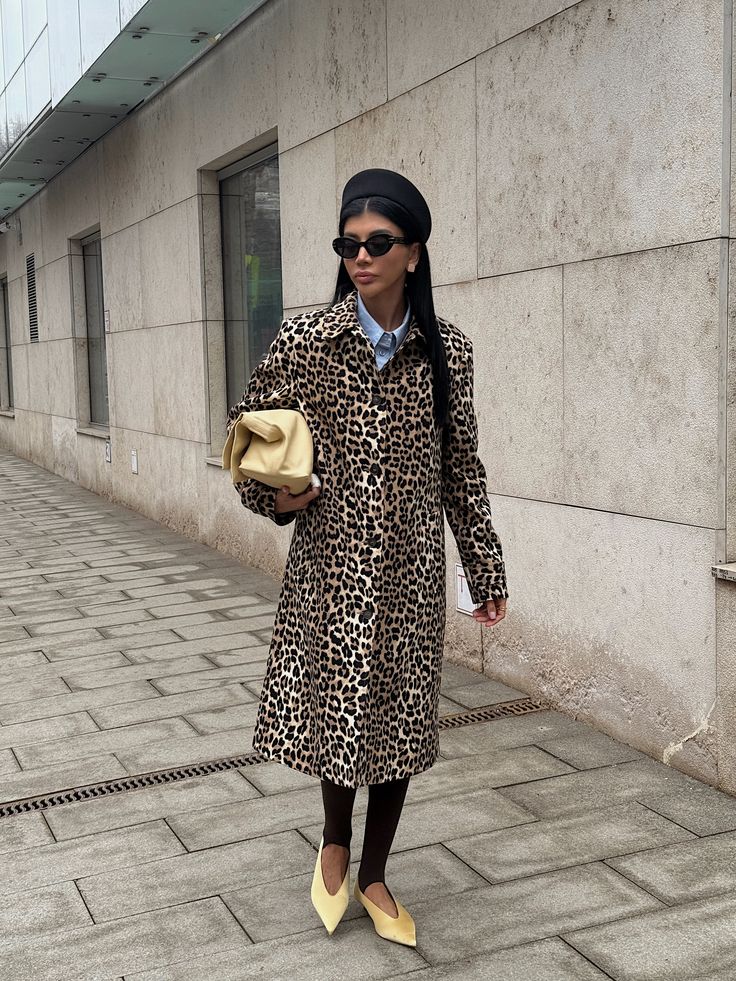 Leopard coat outfit styled with a beret