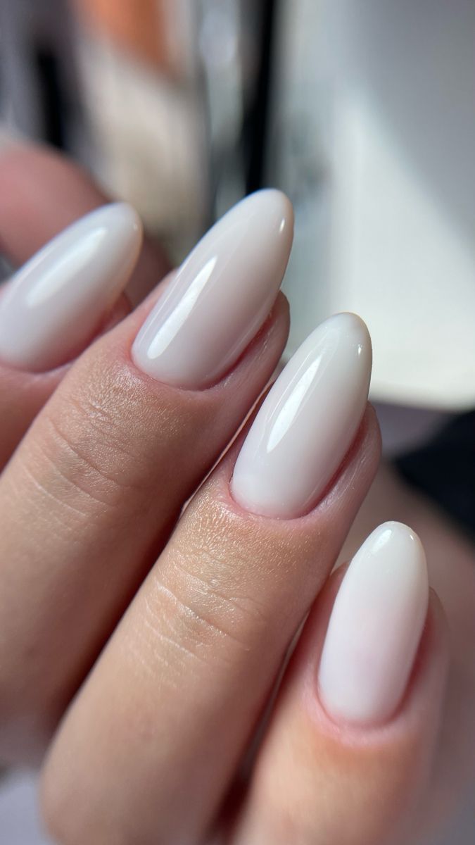 Milky sheer white nails on long almond shape