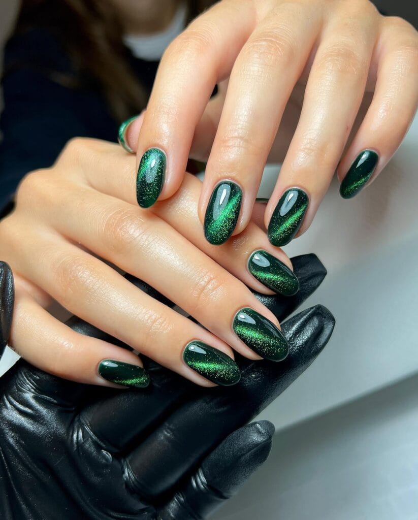 Short oval nails in bottle-green magnetic shimmer