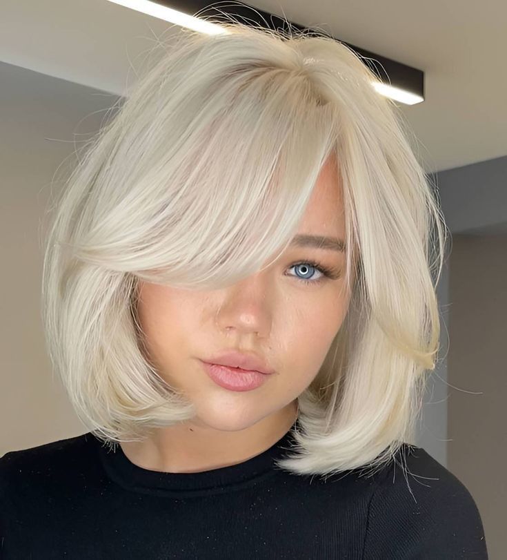 Curly blonde bob with natural curl texture