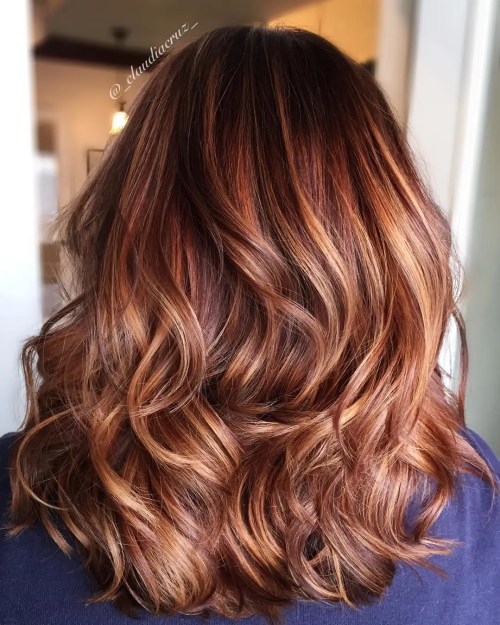 Burgundy hair with caramel highlight ribbons