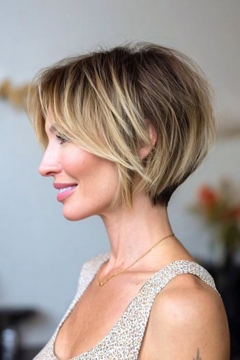 Wispy highlighted bixie haircut with piecey texture