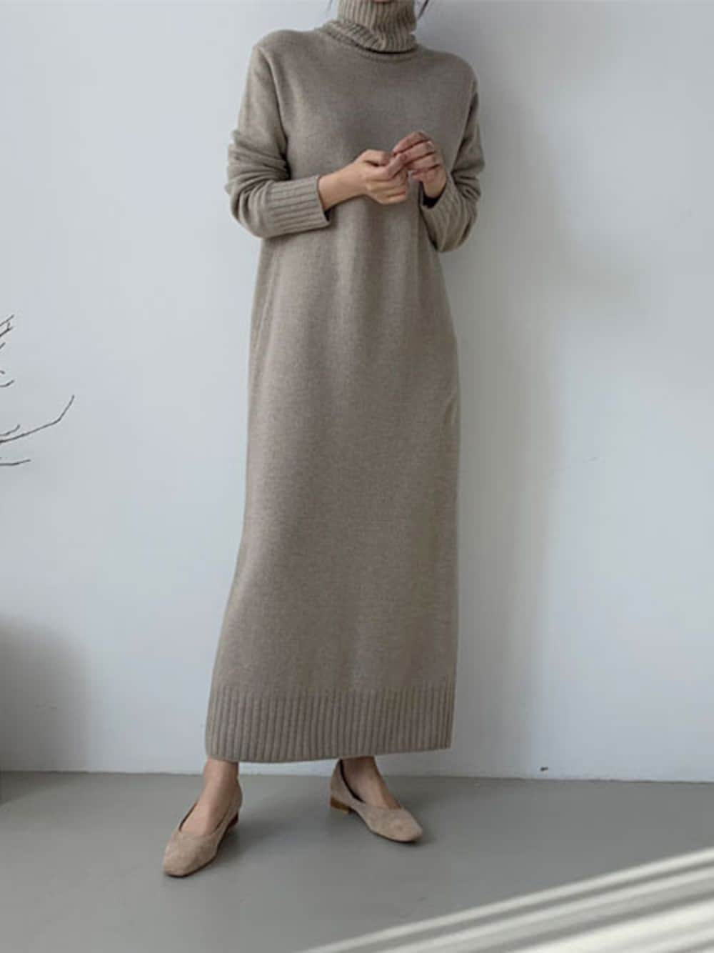 Taupe-beige turtleneck knit maxi sweater dress with a straight relaxed silhouette and beige ballet flats