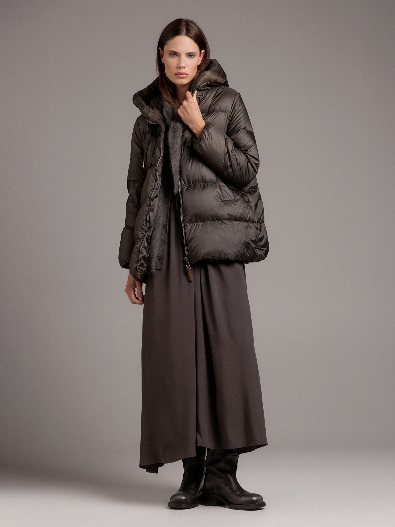 Dark olive quilted puffer jacket with grey knit scarf and dark satin maxi skirt