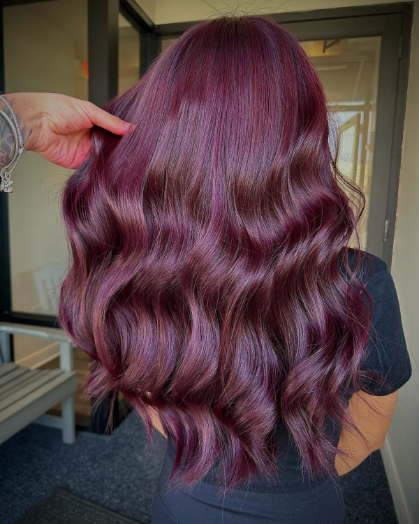 Back view of long violet-plum cherry cola waves