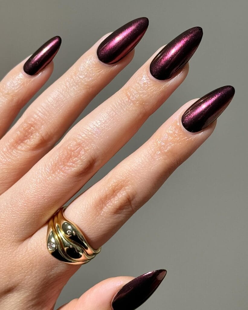Almond nails in deep plum metallic chrome