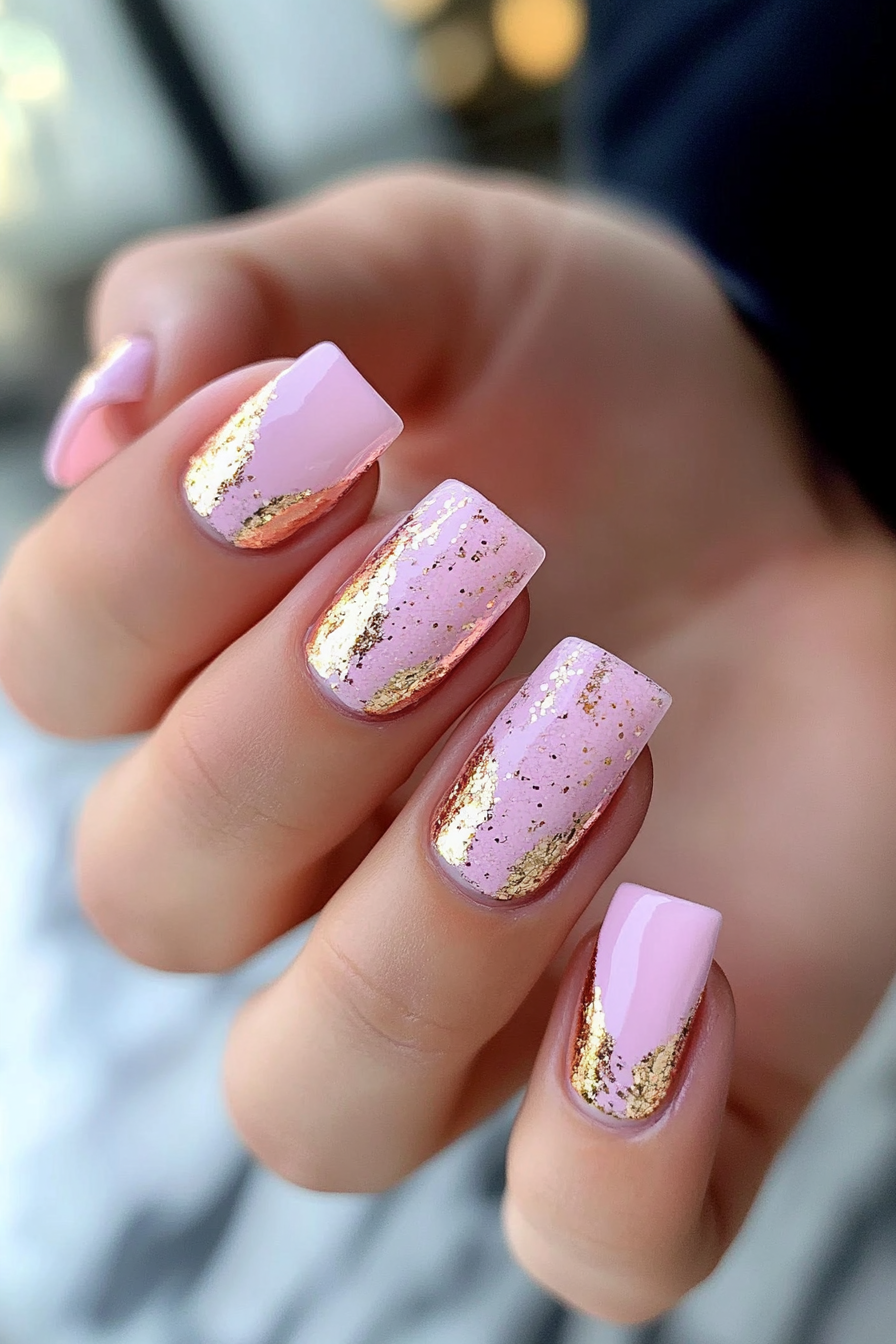 Short square nails in blush pink with rose gold foil flake accents