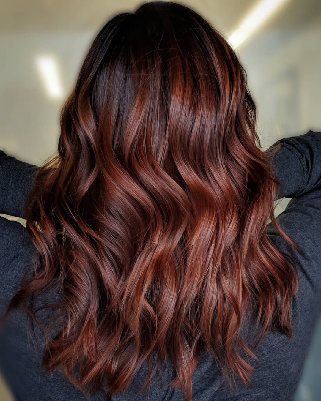 Mahogany root melt blending into warm copper-chestnut waves