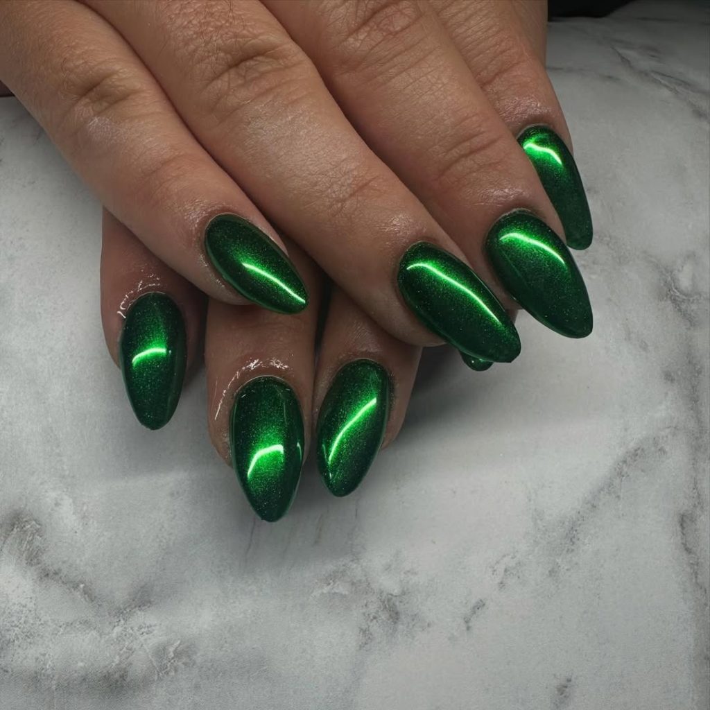 Medium almond nails with metallic emerald chrome finish