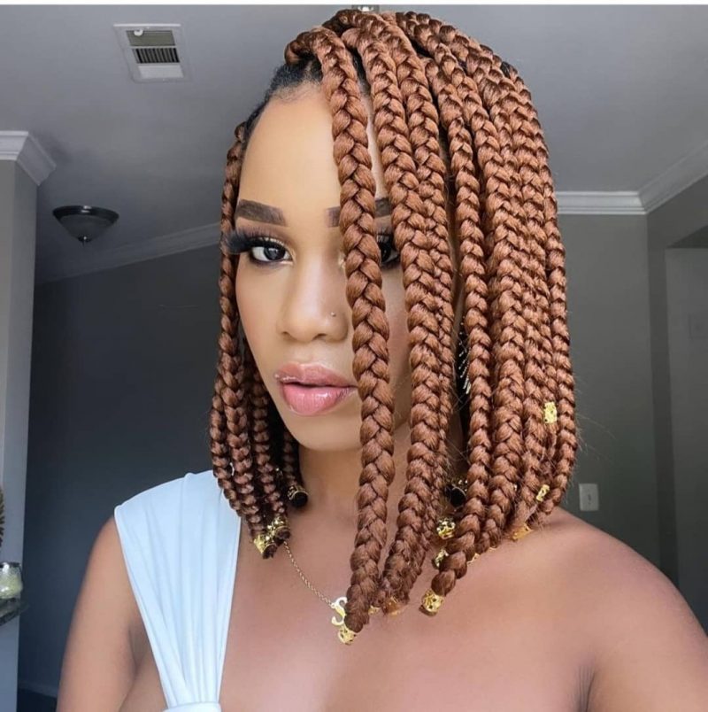Golden brown chin-length bob braids on a Black woman