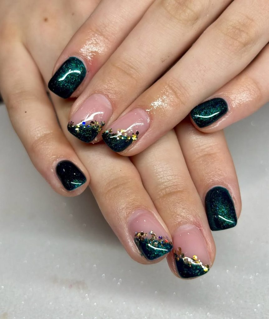 Short Christmas nails with emerald glitter French tips edged in gold foil