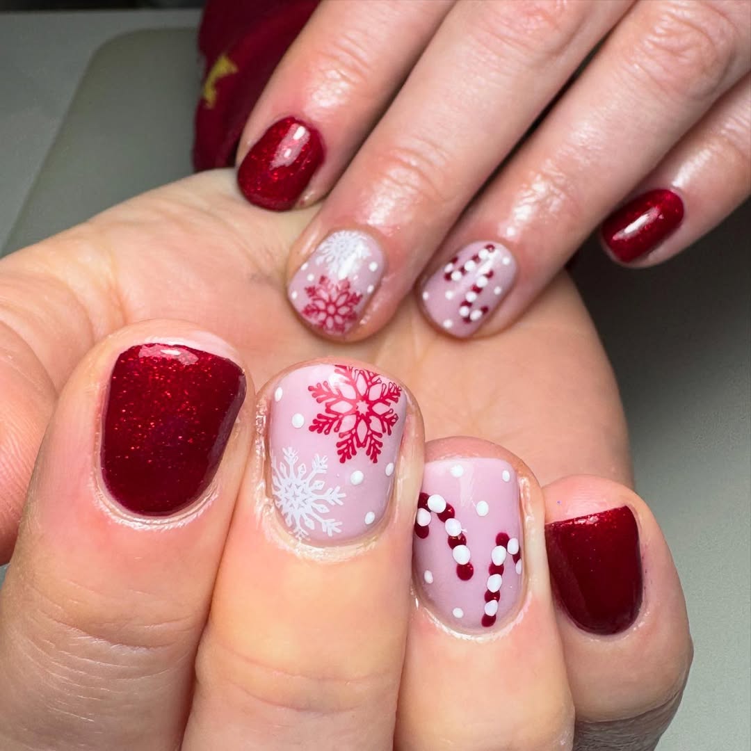 Short red glitter Christmas nails with snowflake accent art
