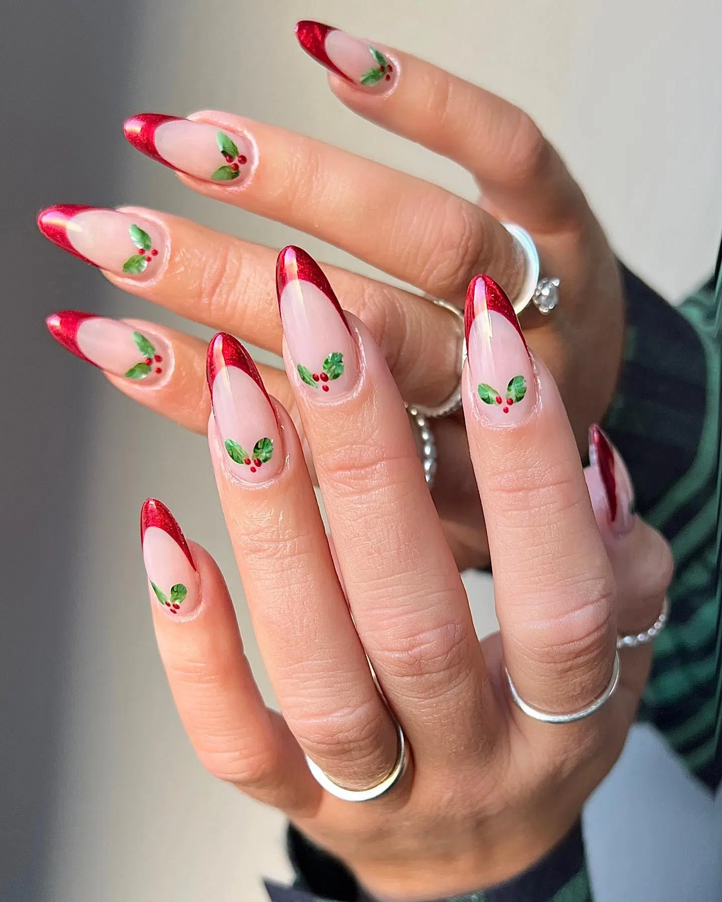 Red French tip nails with holly berry accents